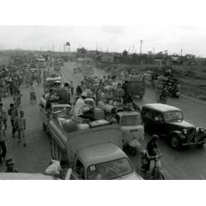 Refugees Fleeing the Advance of Communist Forces Pour into Saigon 