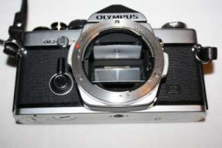   OM 2 35mm SLR Camera + Olumpus Zuiko 50mm 11.8 Lens + strap  