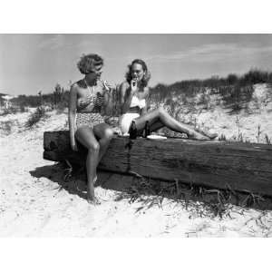  Two Women in Bikini Eating Snack on Beach Photographic 