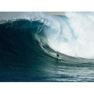  A Surfer Rides a Powerful Wave off the North Shore of Maui 