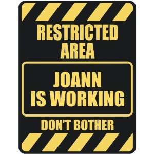   RESTRICTED AREA JOANN IS WORKING  PARKING SIGN