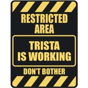   RESTRICTED AREA TRISTA IS WORKING  PARKING SIGN