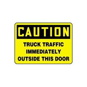  CAUTION TRUCK TRAFFIC IMMEDIATELY OUTSIDE THIS DOOR Sign 