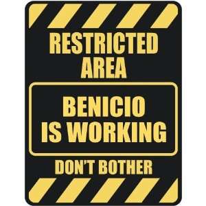   RESTRICTED AREA BENICIO IS WORKING  PARKING SIGN