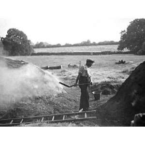  A Farmer Holding a Shovel on a Farm in England, 1938 