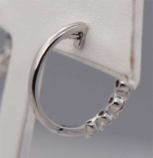 This is a pair of beautiful Diamond hoop earrings with shared prong 