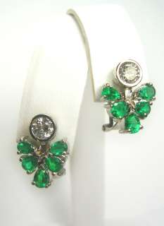   natural vibrant green emeralds and scintillating diamond s