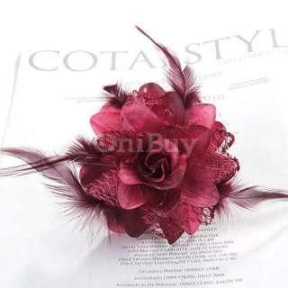  style hair flower with color coordinating feather accents. A perfect 