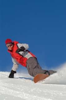 Snowboarder riding his toe side edge