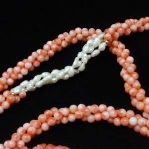 Natural coral and freshwater pearls in a lovely three strand necklace 