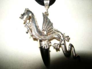 Happy flying Dragon pendant in sterling silver, with clear natural 