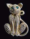 vintage goldtone braided textured cat emerald eyes rhin  or 