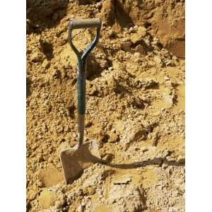 Close up of Spade in Sand on a Building Site, City of London, England 