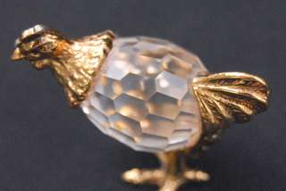   and crystal hen figurine this gold plate and crystal figurine is a